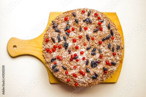 Homemade cake on a wooden board. photo