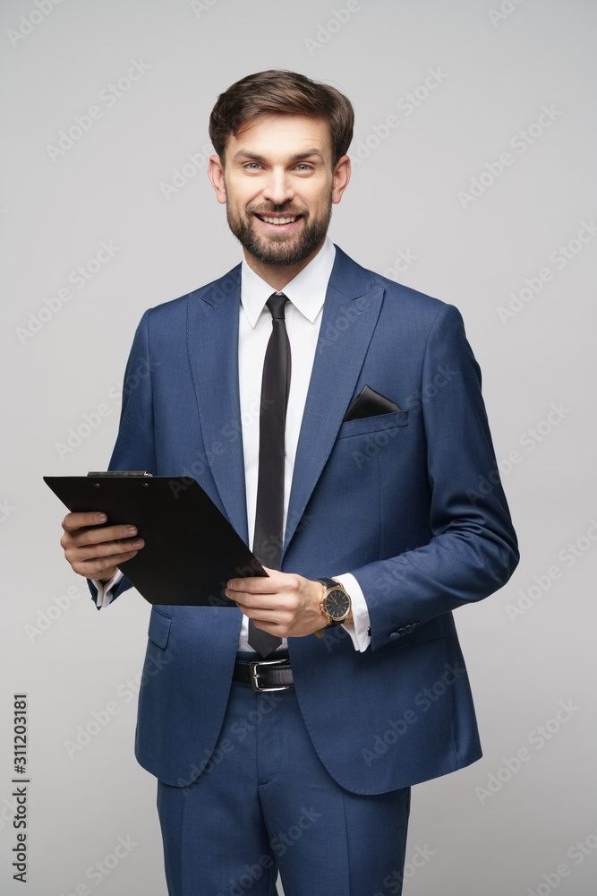 Portrait of a handsome young business man holding folder Portrait of a handsome young business man holding folder