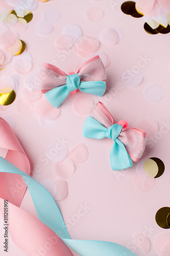 Set of baby accessories for hair on a pink pastel background. Concept of baby party, birthday, beauty hair saloon for kids, kawaii hairpins, Place for text