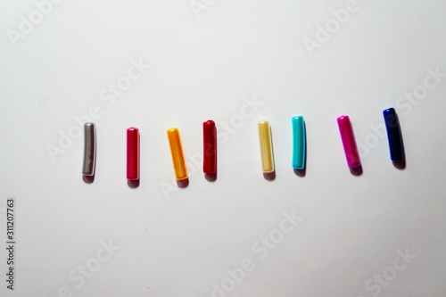 colorful markers on white background