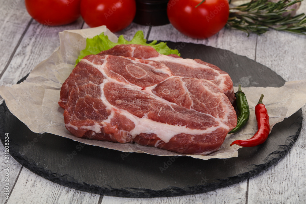 Raw pork neck steak