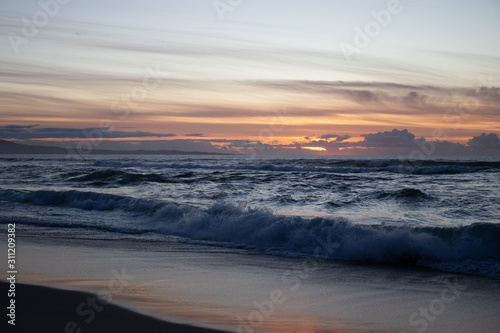 Sunset waves at Marina State Beach in Monterey County California 