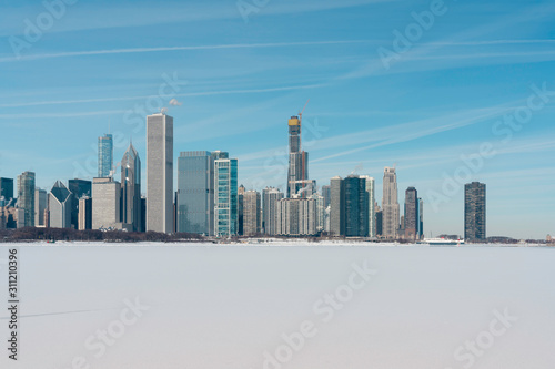 Chicago downtown skyline in winter scenery with snow covers Lake Michigan