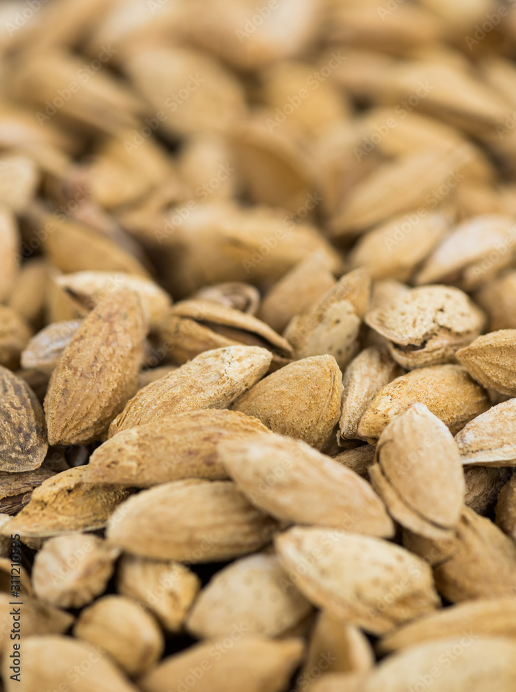Fototapeta premium Roasted Almonds (in shell) as background image
