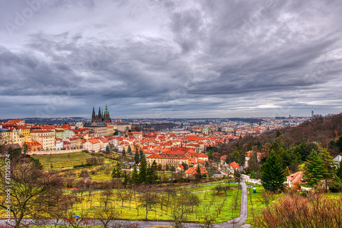 orchards of trees and in the background Mala Strana with cathedral and castle prague with beautiful sky