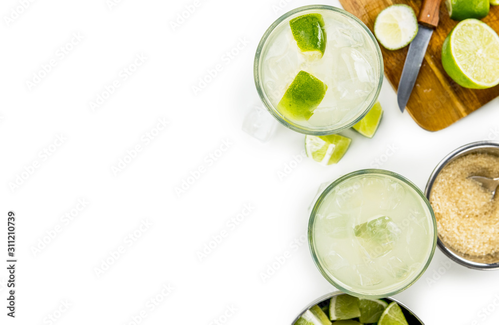 Caipirinha as detailed close-up shot isolated on white background (selective focus)