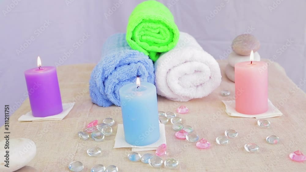 Table in the Spa salon with candles, towels and stones for therapy Table in the Spa salon with candles, towels and stones for therapy