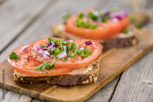 Some fresh Tomato Sandwich (selective focus; close-up shot)