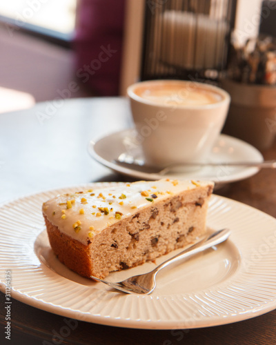 Piece of cake with coffee.