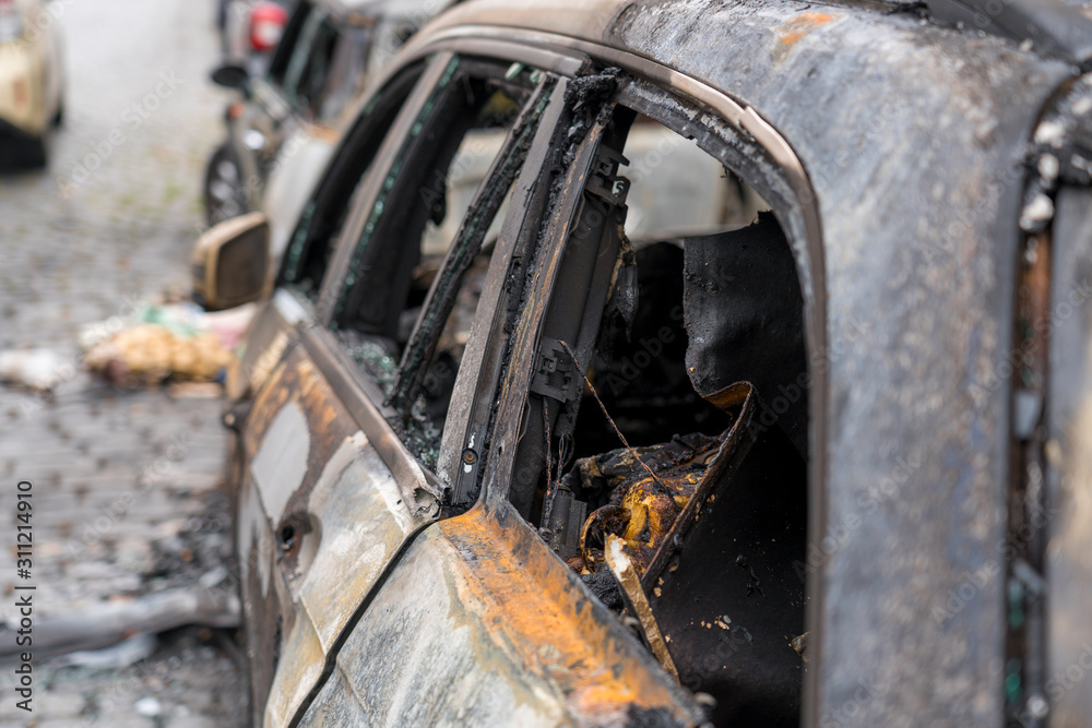 burnt out car in the streets of berlin burnt out car in the streets of berlin