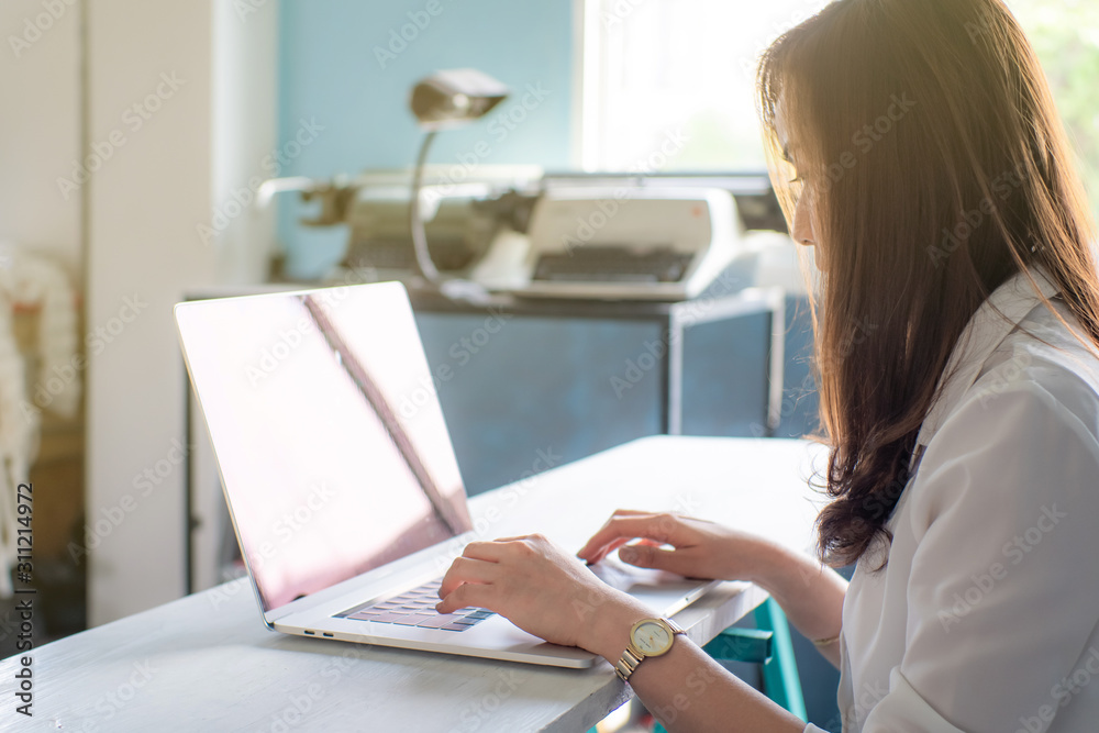 Business asian women casual wear sitting in cozy living room use internet by laptop Business asian women casual wear sitting in cozy living room use internet by laptop