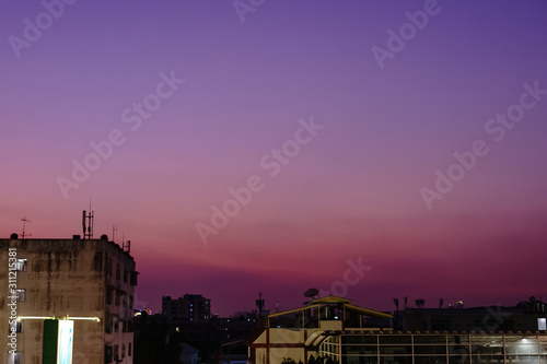 Photos of city buildings at night with beautiful sunset lights.
