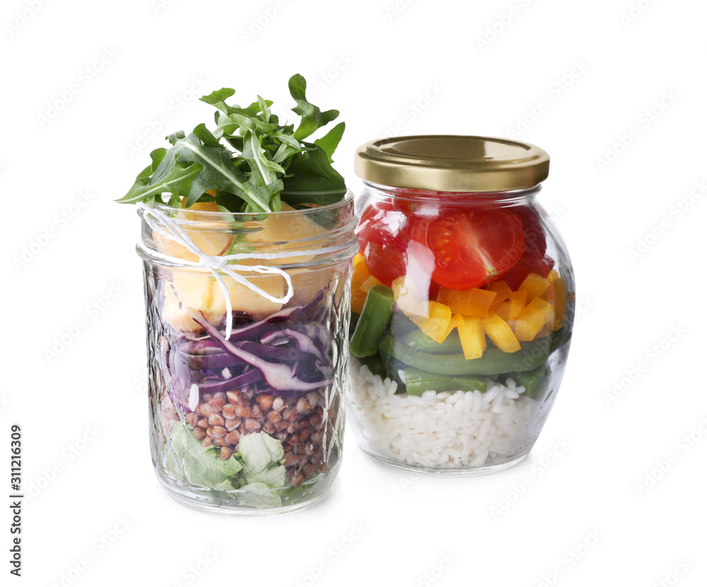 Glass jars with healthy meal isolated on white Glass jars with healthy meal isolated on white