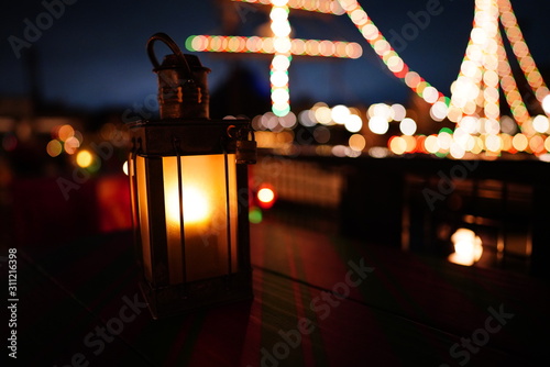 a lantern at the bay in the night 