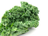 Green kale leaves, one of the super foods, isolated on a white background, beneficial for health lovers. High in antioxidants