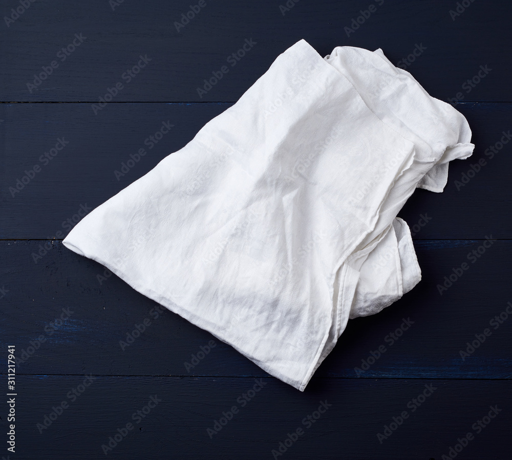 white linen towel on blue wooden background