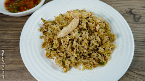 Thai cuisine ,fried rice with crab on wood table background. 