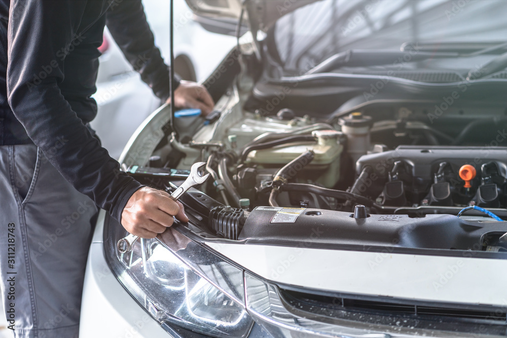 Hand of mechanic man hold spanner tool, inspection and mentenance car service Hand of mechanic man hold spanner tool, inspection and mentenance car service