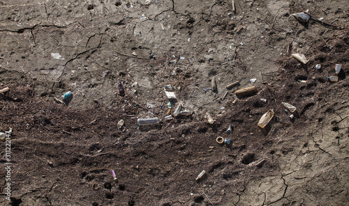 Wallpaper Mural garbage an waste in the cracked soil and ground. environment pollution Torontodigital.ca