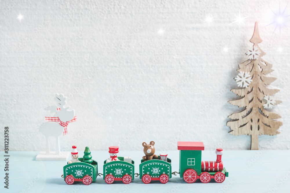 Christmas and New year holidays background. Toy train and chrismtas decorations on the white background. Copy space