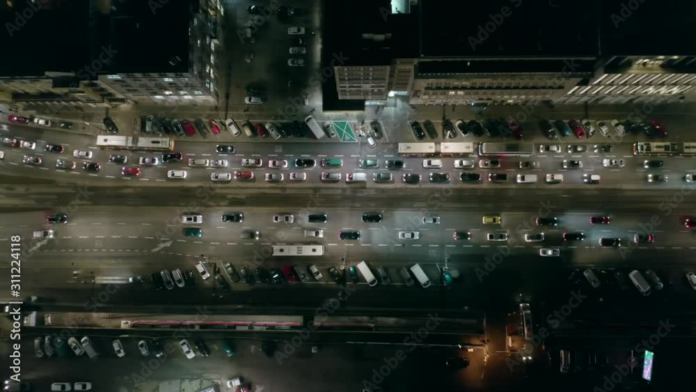 Drone shot shows an impressive hill elevation with traffic at rush hour at night, in Berlin, the development of transport and infrastructure in Germany. Drone shot shows an impressive hill elevation with traffic at rush hour at night, in Berlin, the development of transport and infrastructure in Germany.