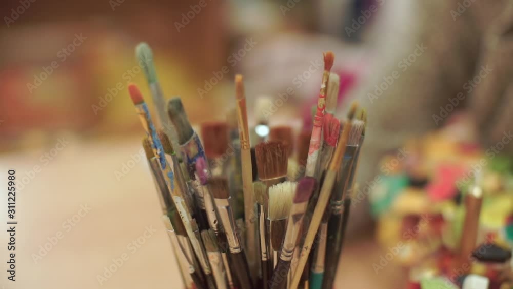 Close-up of brushes for painting in the artist workshop. Close-up of brushes for painting in the artist workshop.