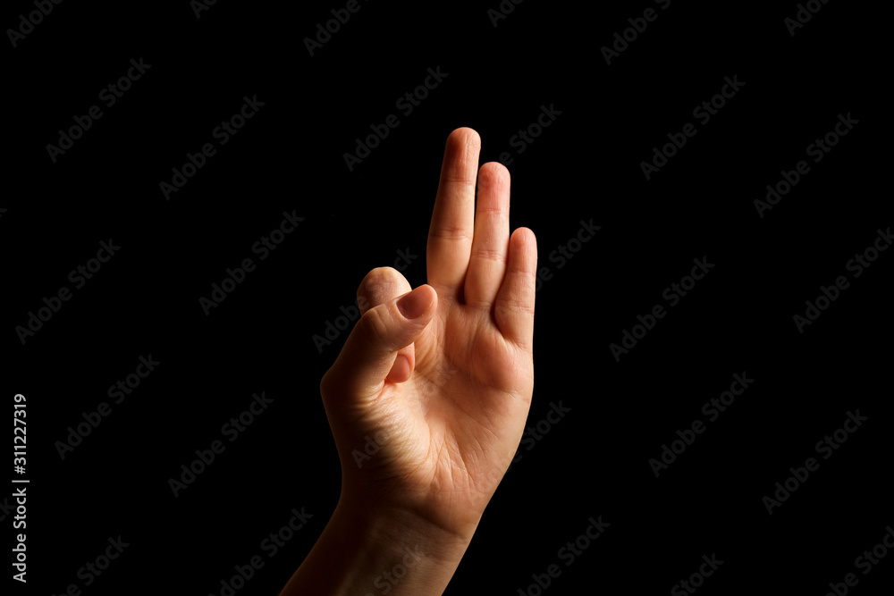 Hand Showing Sign of F Alphabet in American Sign Language (ASL), isolated on black background. Sign language Hand Showing Sign of F Alphabet in American Sign Language (ASL), isolated on black background. Sign language