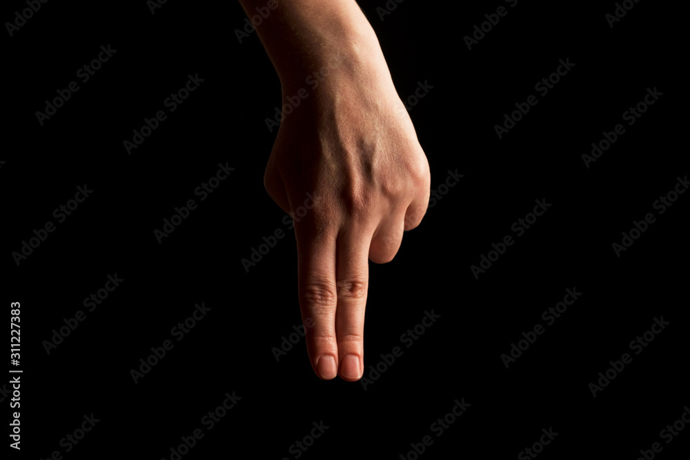 Hand Showing Sign of N Alphabet in American Sign Language (ASL), isolated on black background. Sign language Hand Showing Sign of N Alphabet in American Sign Language (ASL), isolated on black background. Sign language
