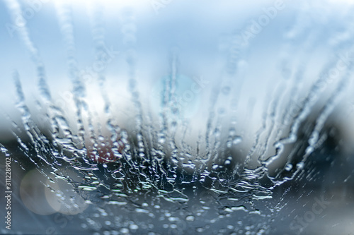 drops of water and bokeh on a car windshield
