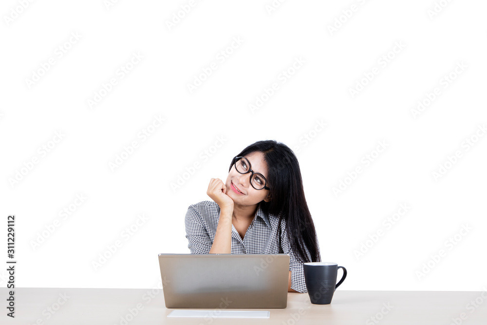 Portrait of businesswoman musing and daydreaming