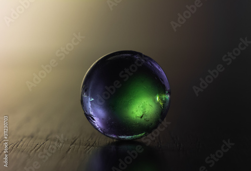 Glass ball in colours. Crystal ball in abstract colours. Magic ball.