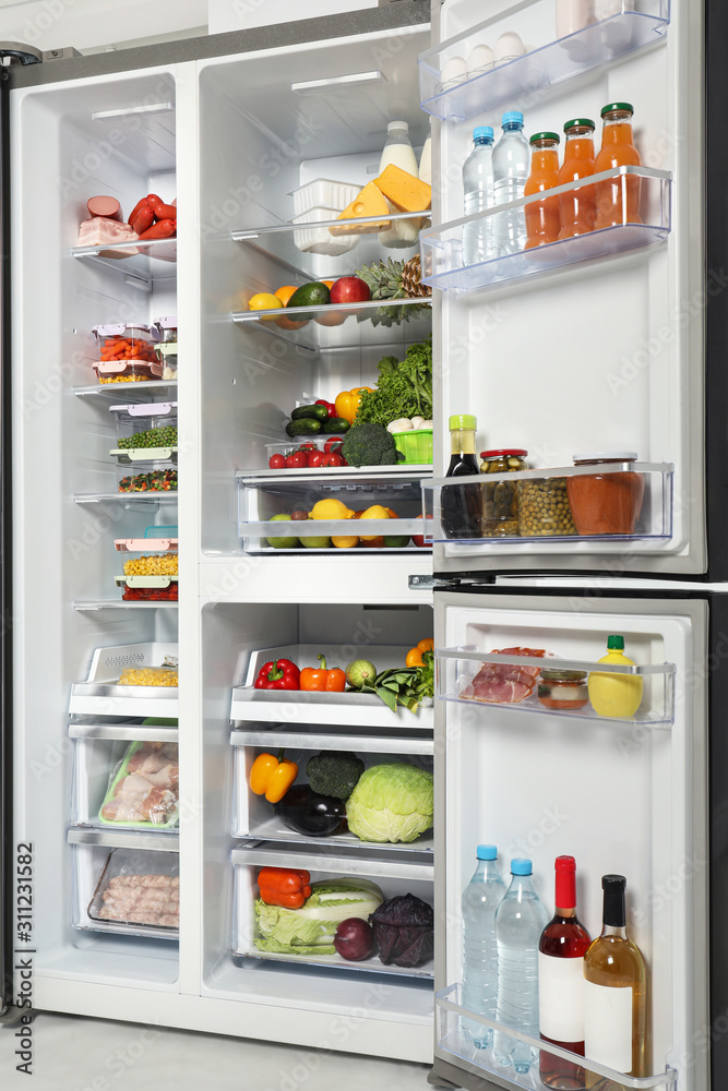 Open refrigerator full of different fresh products Open refrigerator full of different fresh products