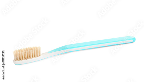 Natural bristle toothbrush with blue handle isolated on white