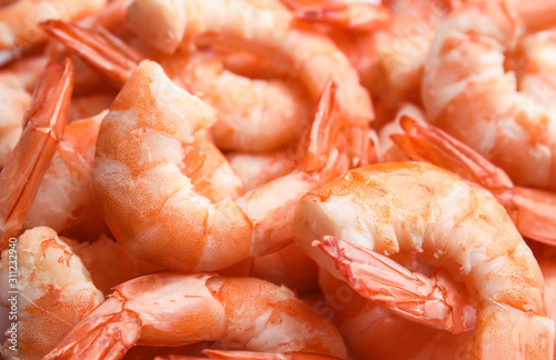 Pile of delicious peeled shrimps as background, closeup photo