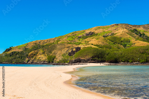 View of the sandy beach of the island, Fiji. Copy space for text. © ggfoto