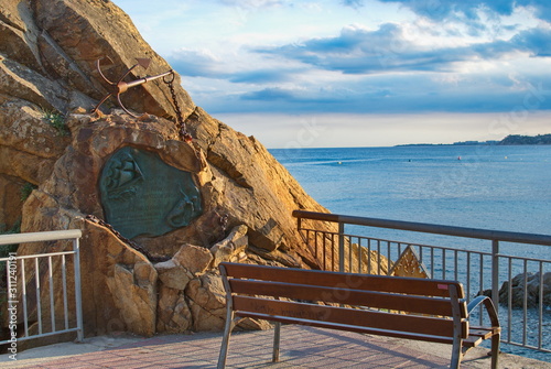 Barcelona, Spain - 18.08.2019: Bench overlooking the blue sea