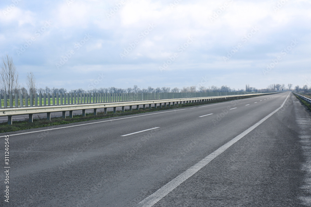Beautiful view of asphalt highway without transport Beautiful view of asphalt highway without transport
