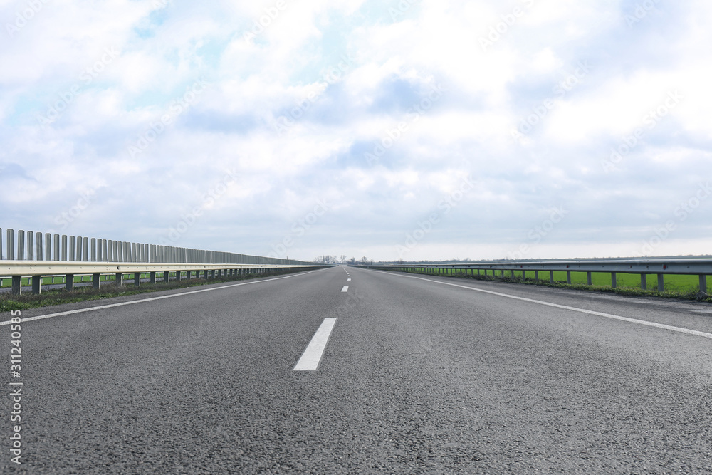 Fototapeta premium Beautiful view of asphalt highway without transport