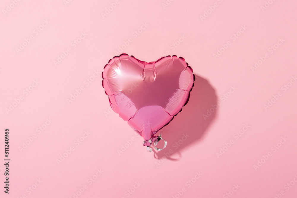 Air balloon heart shape on a pink background. Natural light. Banner. Concept love, wedding, photo zone. Flat lay, top view