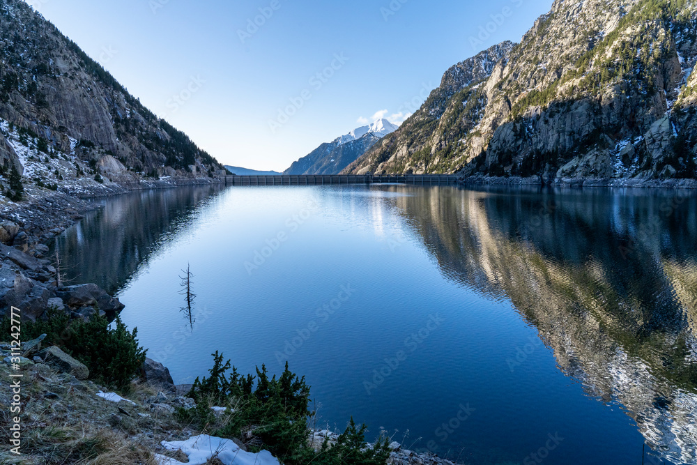 Cavallers reservoir in National Park of Aigüestortes and lake of Sant Maurici. Cavallers reservoir in National Park of Aigüestortes and lake of Sant Maurici.