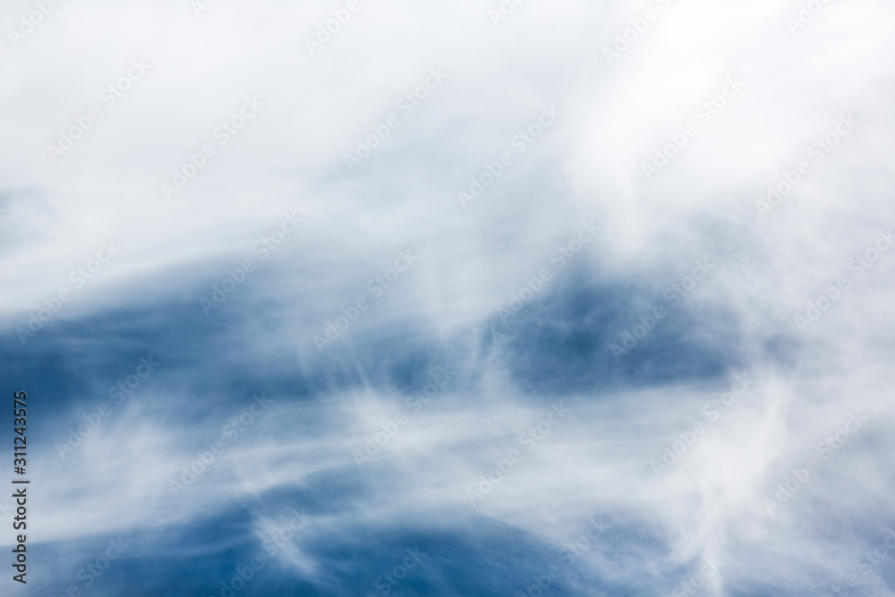 Fototapeta premium Beautiful white clouds against a vivid blue sky