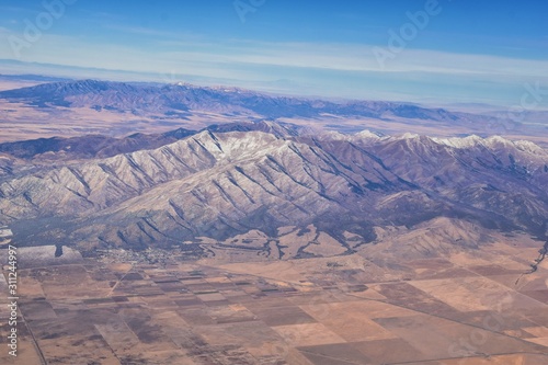 Rocky Mountains, Oquirrh range aerial views, Wasatch Front Rock from airplane. South Jordan, West Valley, Magna and Herriman, by the Great Salt Lake Utah. United States of America. USA.