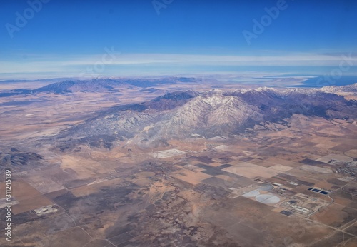 Rocky Mountains, Oquirrh range aerial views, Wasatch Front Rock from airplane. South Jordan, West Valley, Magna and Herriman, by the Great Salt Lake Utah. United States of America. USA.