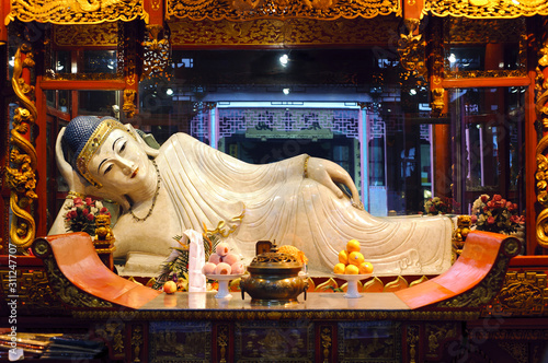 SHANGHAI, CHINA - APRIL 5, 2013 - Reclining Buddha at the Jade Buddha Temple, Shanghai, China