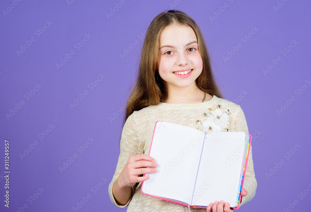 Kid show book notepad. Book concept. Childhood literature. Development and education. Reading skill. Personal diary. Notepad planner. School stationery. Learn more. Girl hold book violet background Kid show book notepad. Book concept. Childhood literature. Development and education. Reading skill. Personal diary. Notepad planner. School stationery. Learn more. Girl hold book violet background