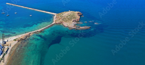 Aerial drone ultra wide photo of iconic ancient temple of Apollo or Portara located in main port and town of Naxos island, Cyclades, Greece photo