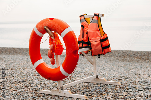 life buoy on the beach and life jacket