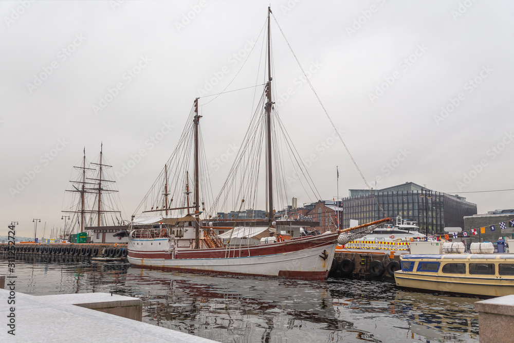 Sailing ships in winter berth in the port of Oslo