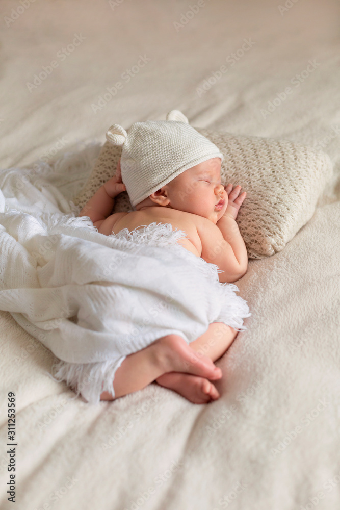 Portrait of cute sleeping newborn baby in white knitted hat in light bedroom.  Family, motherhood, love, health, innocence and care фотография Stock |  Adobe Stock