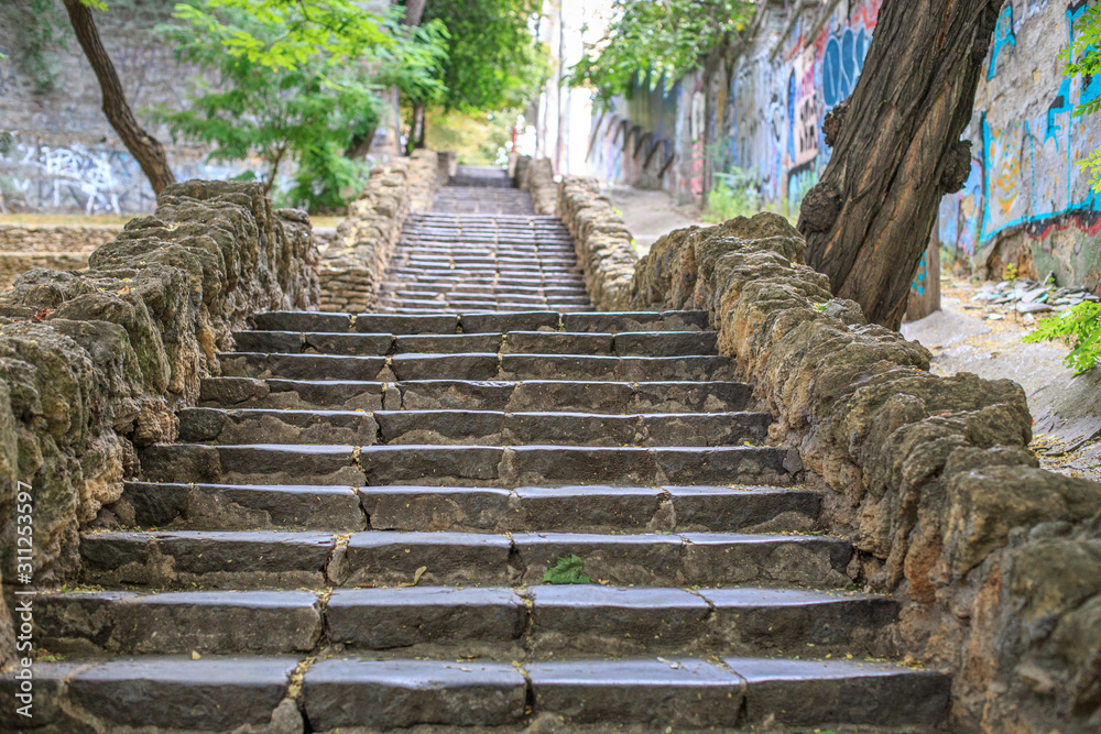 An old stone staircase in the isthropic city An old stone staircase in the isthropic city